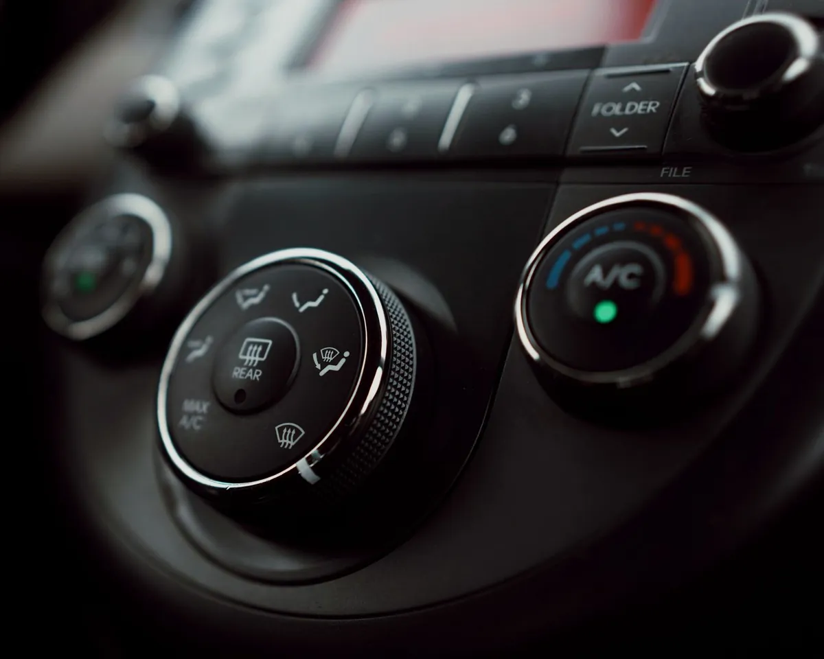 A car’s air conditioning control dial on the dashboard