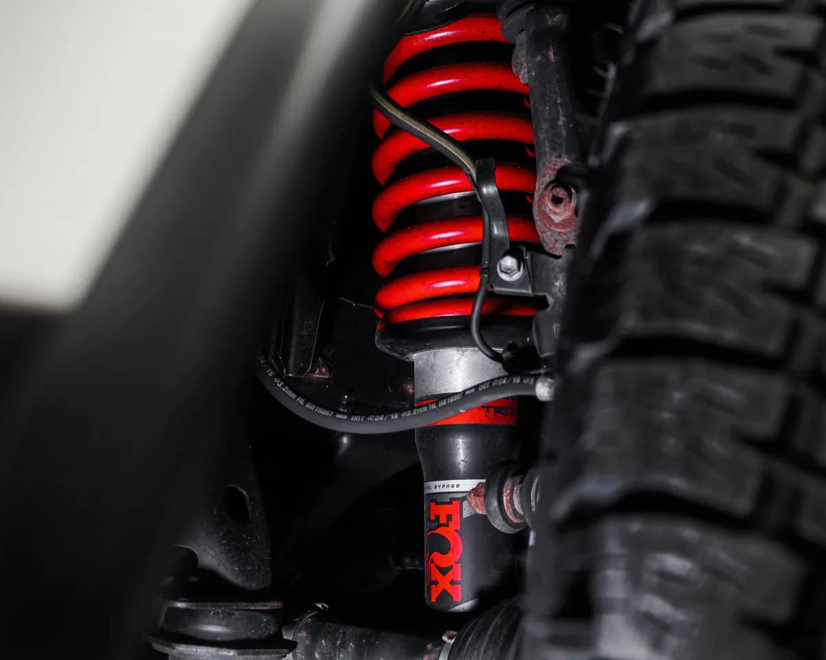 Automotive shock absorber and coilover suspension